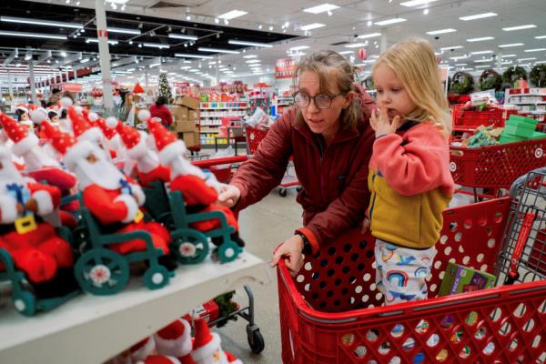 Margaret Sietsema and her daughter Azalea Sietsema shop at a Target store ahead of the Thanksgiving holiday and traditional Black Friday sales in Chicago, Illinois, U.S. November 21, 2023.  REUTERS/Vincent Alban