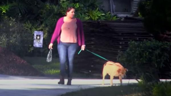 Sydney Simpson walks dog