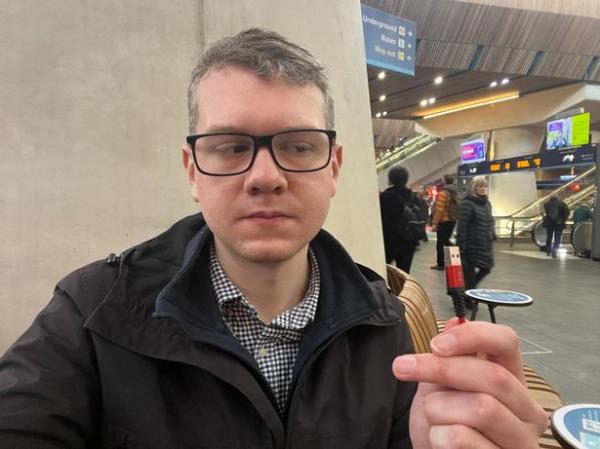 Adam Toms holding USB cable in London Bridge