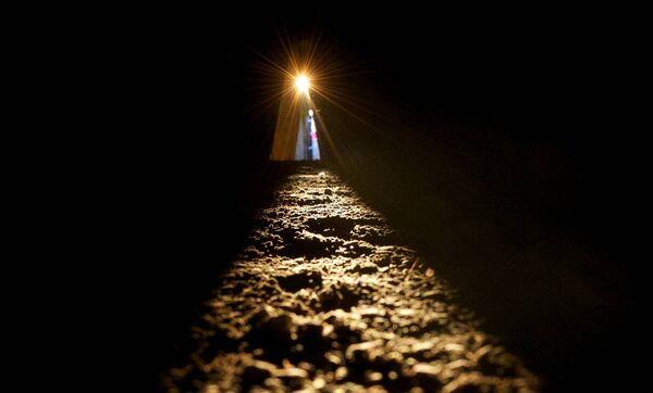 The sun shines along the passage floor into the inner chamber at Newgrange during the Winter Solstice. Picture: Alan Betson / The Irish Times 