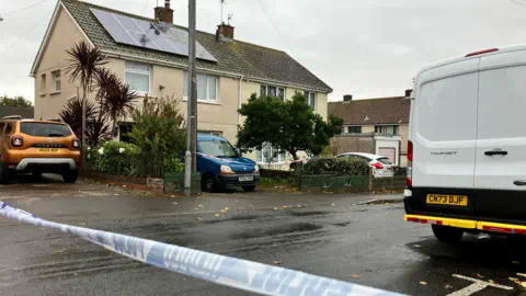 BBC Semi-detached house on Morfa Crescent in Trowbridge. With police tape on foreground